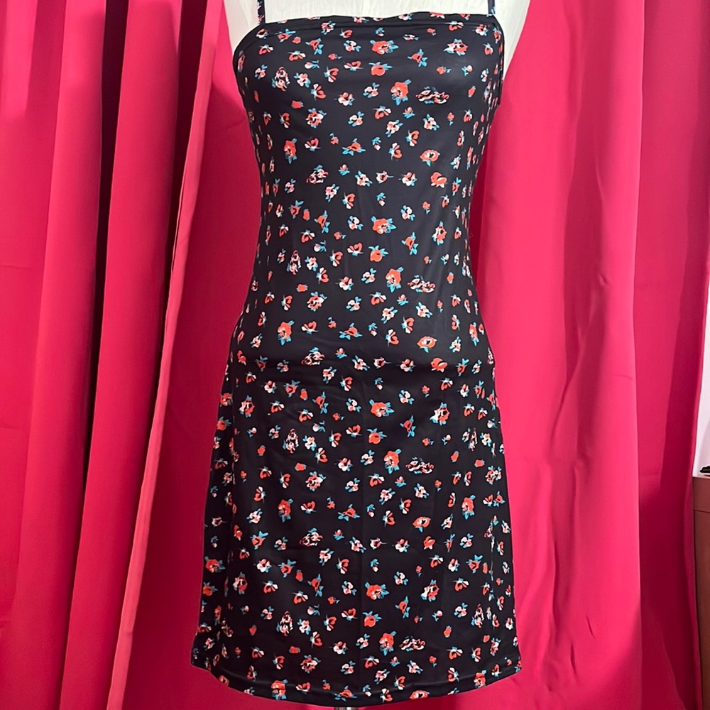 A black floral dress that was never worn.